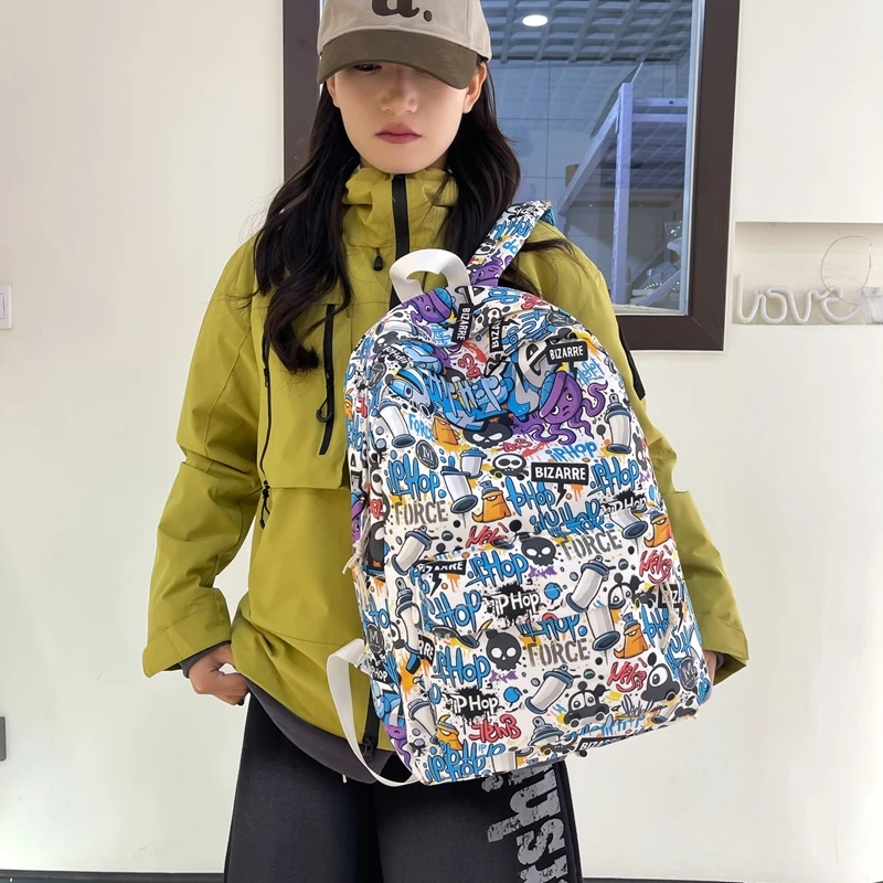 涂鸦潮酷男双肩包女款初高中大学生三色背包大容量厂家直销书包